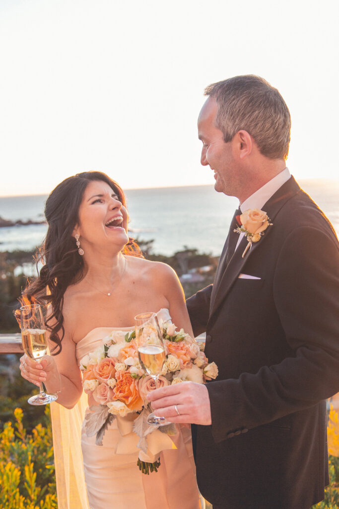 bride and groom toasting with champagne during sunset after their california destination wedding in Carmel by the sea