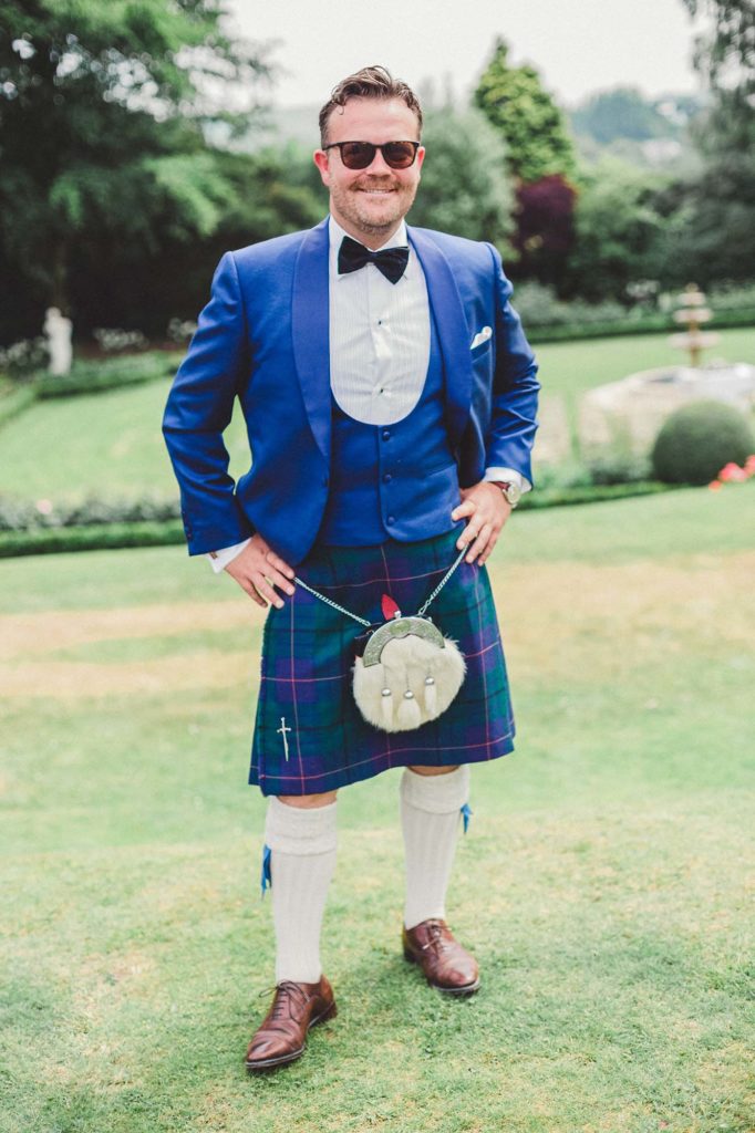 blue suit, black bow tie and kilt for groom style inspiration